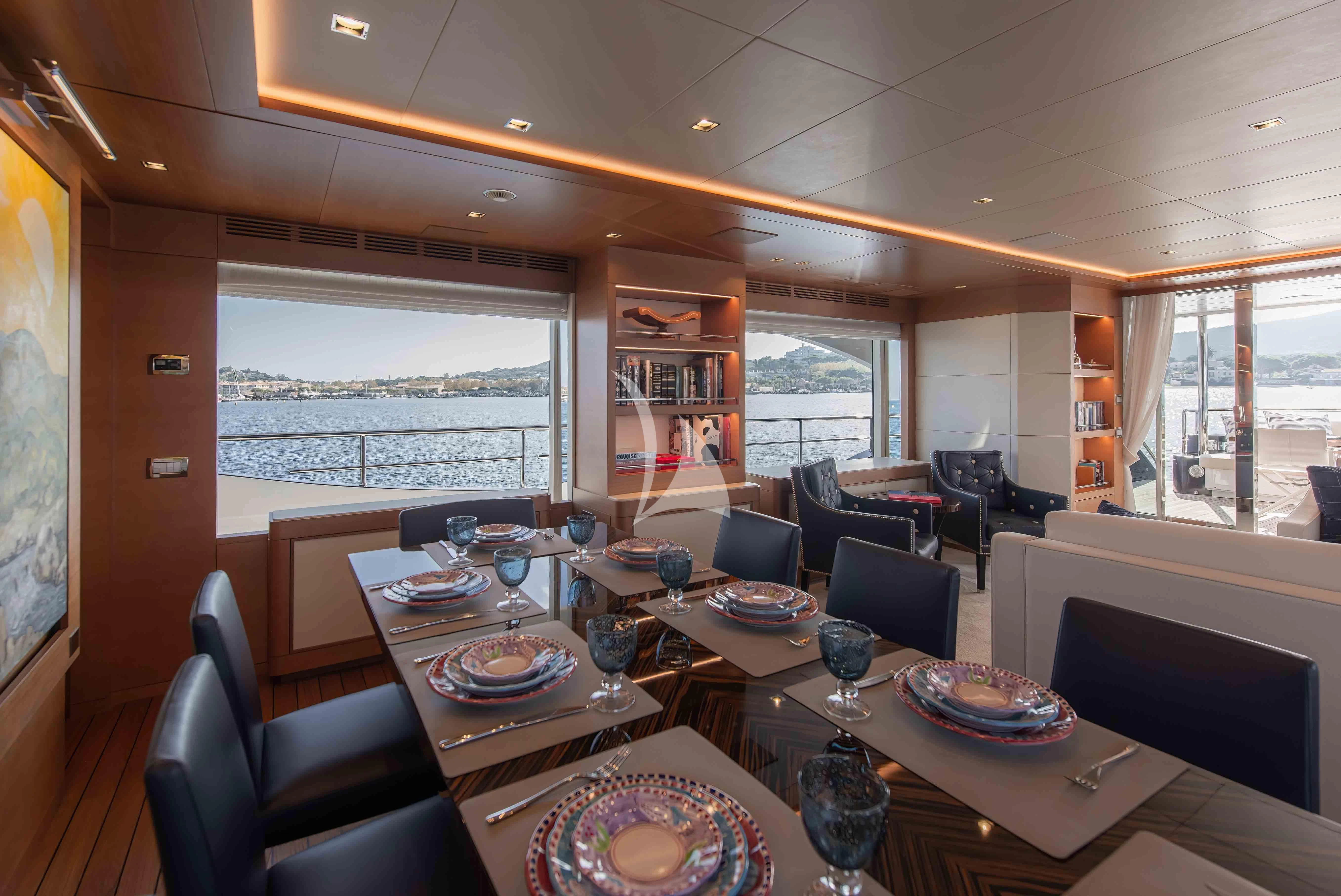 a large dining room with a large window aboard TONIC BLUE Yacht for Sale