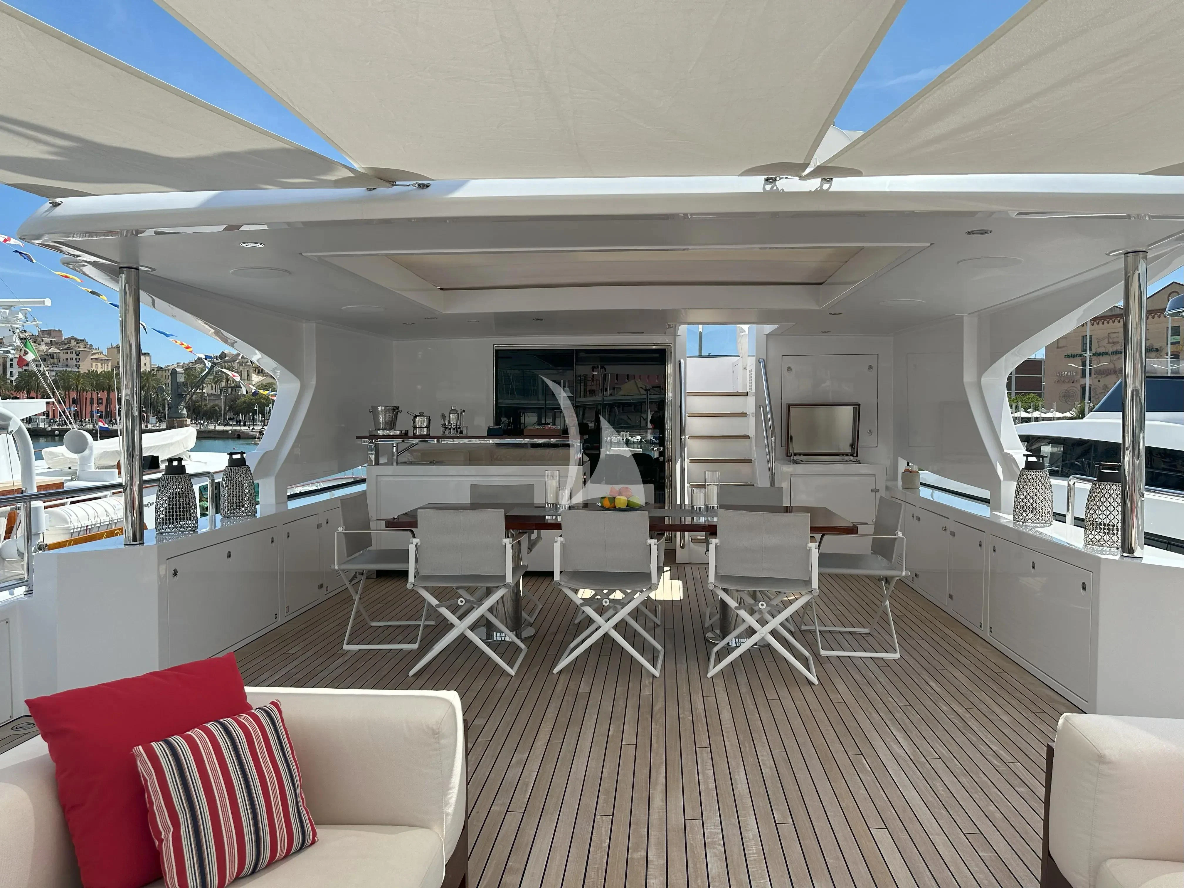 a large kitchen with a table and chairs aboard TONIC BLUE Yacht for Sale