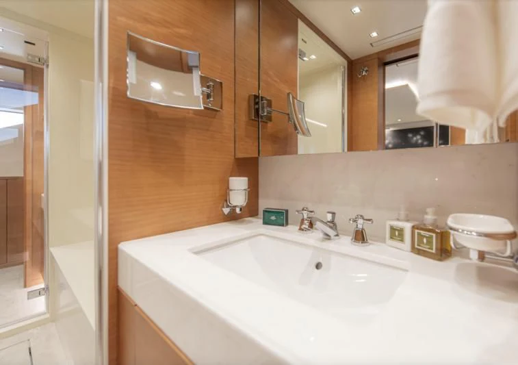 a bathroom with a large mirror aboard TONIC BLUE Yacht for Sale