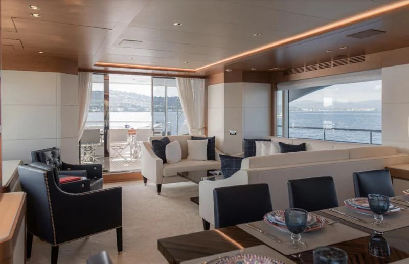 a living room with a large window aboard TONIC BLUE Yacht for Sale