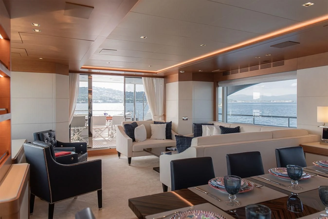 a living room with a large window aboard TONIC BLUE Yacht for Sale