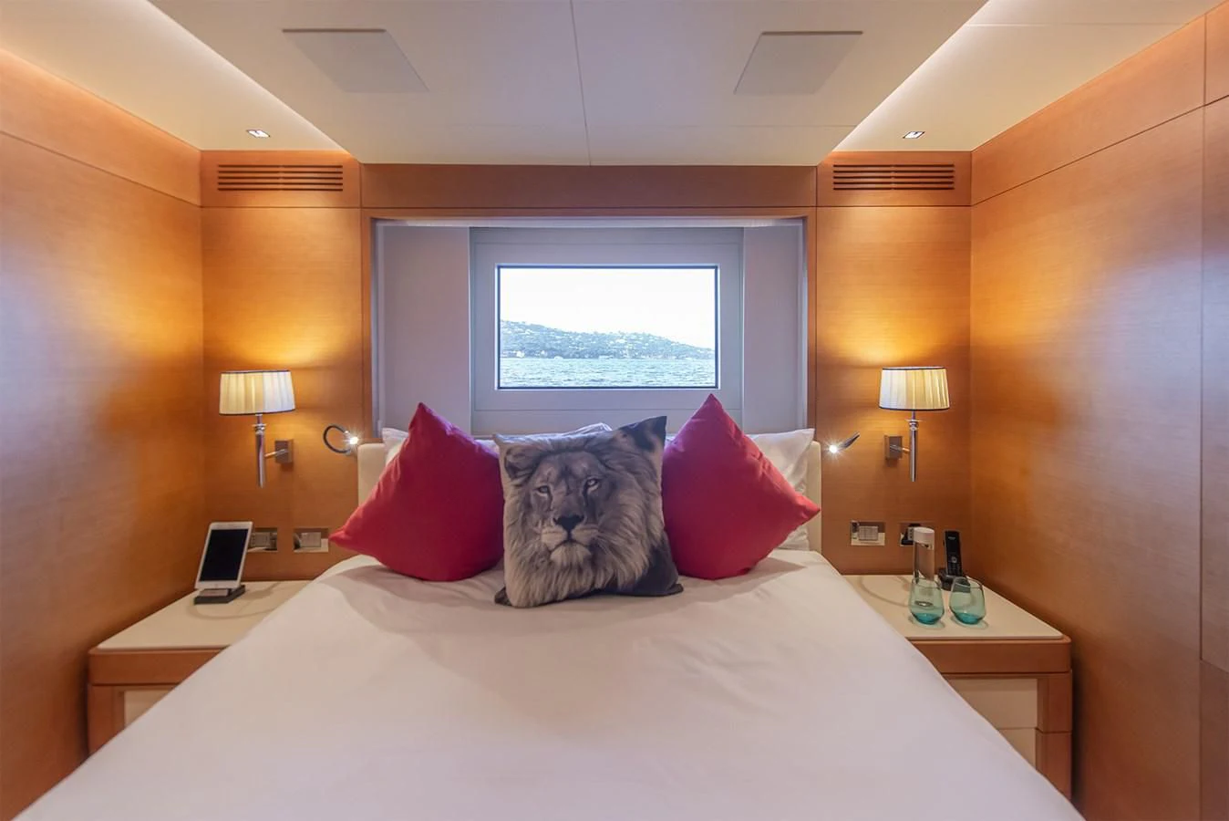 a bed with a white bed spread aboard TONIC BLUE Yacht for Sale