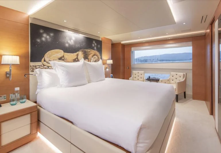 a bed with white sheets aboard TONIC BLUE Yacht for Sale