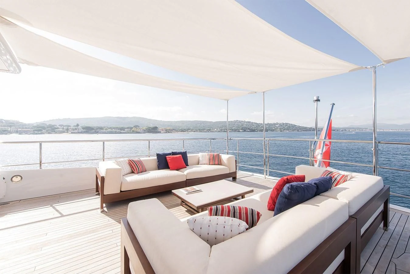 a large white tent with a couch and a table in it aboard TONIC BLUE Yacht for Sale