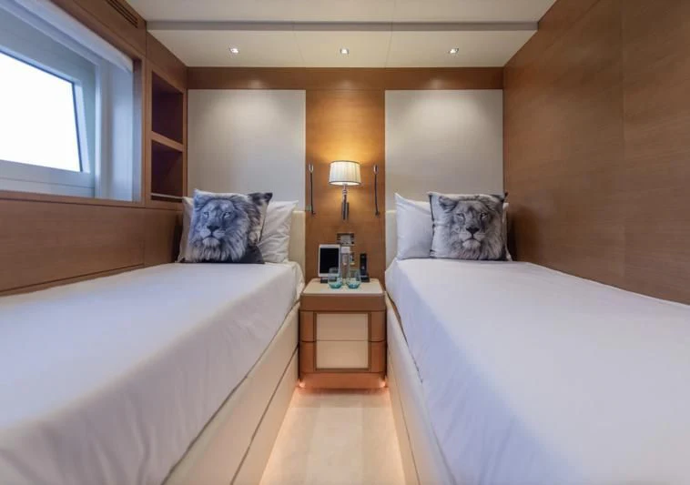 a room with two beds aboard TONIC BLUE Yacht for Sale