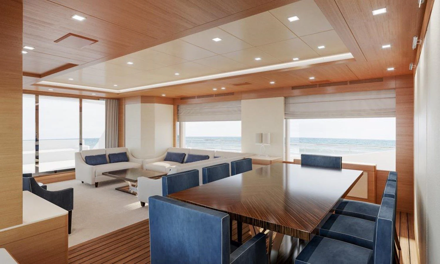 a large room with a table and chairs aboard TONIC BLUE Yacht for Sale