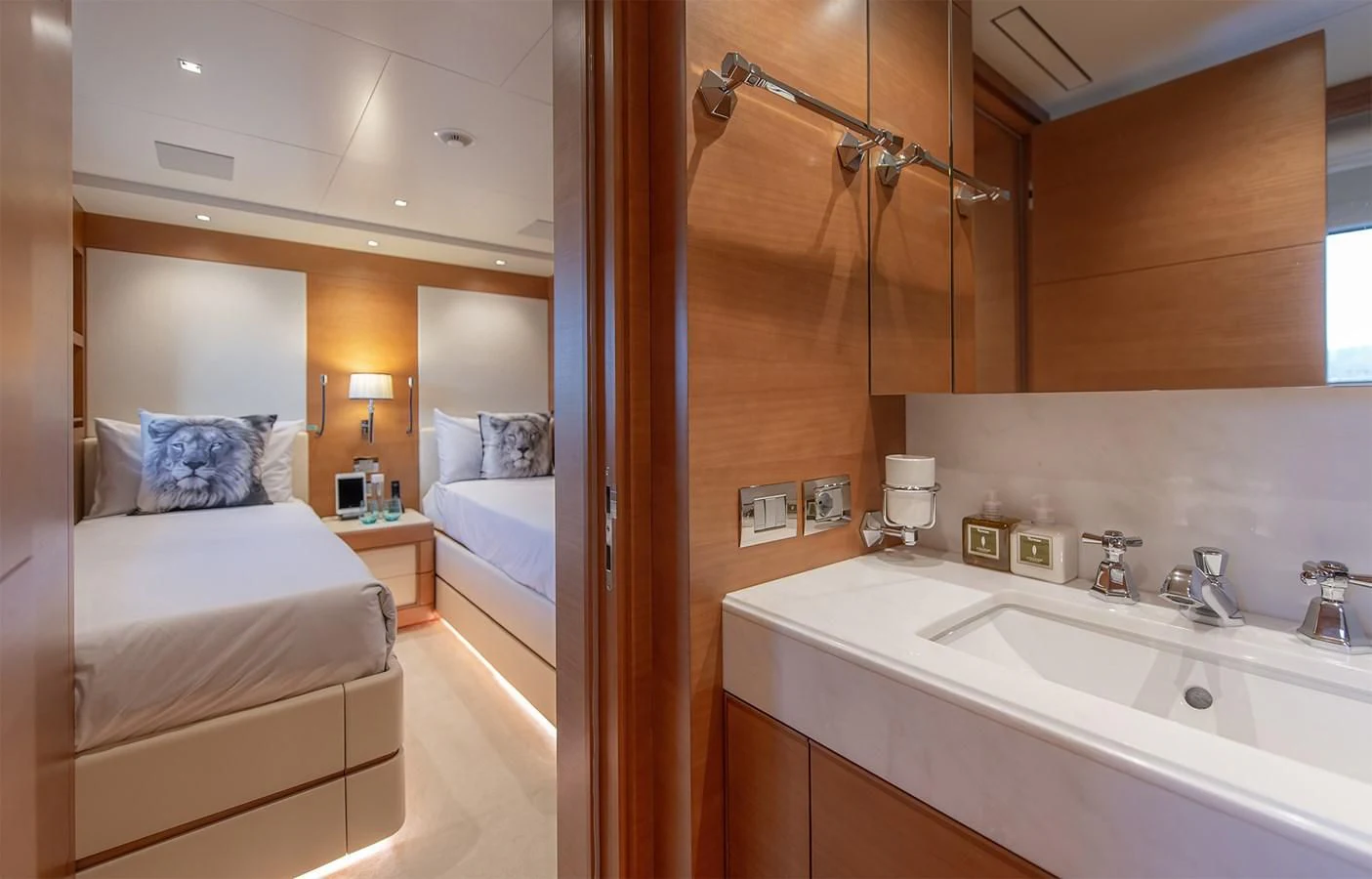 a bathroom with a bed and a sink aboard TONIC BLUE Yacht for Sale