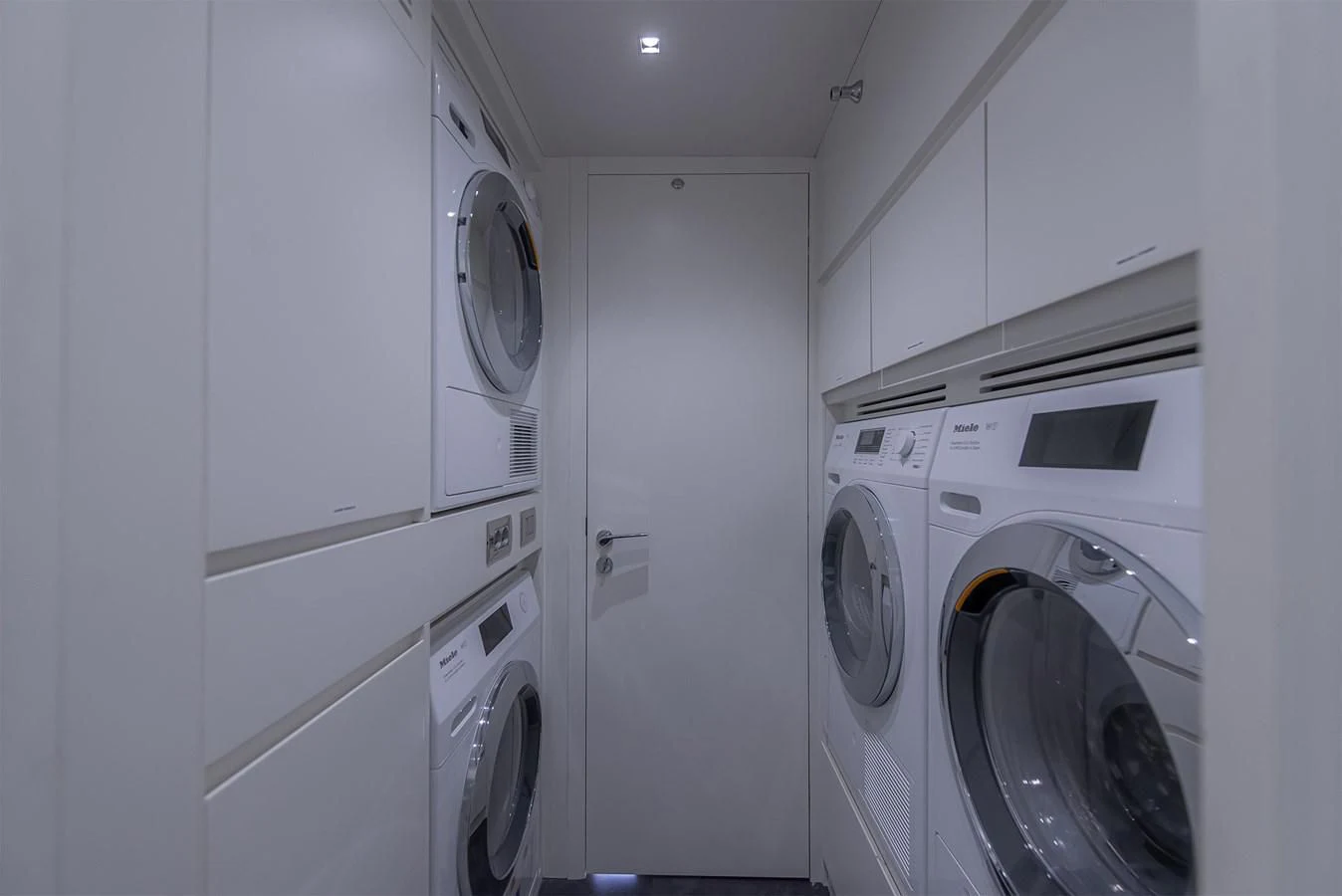 a room with white cabinets aboard TONIC BLUE Yacht for Sale