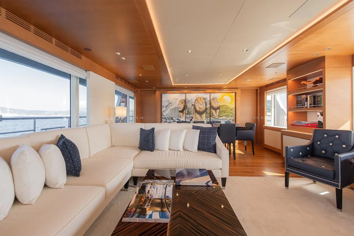 a living room with a couch and a coffee table aboard TONIC BLUE Yacht for Sale