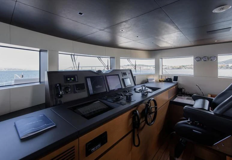 a room with computers and chairs aboard TONIC BLUE Yacht for Sale