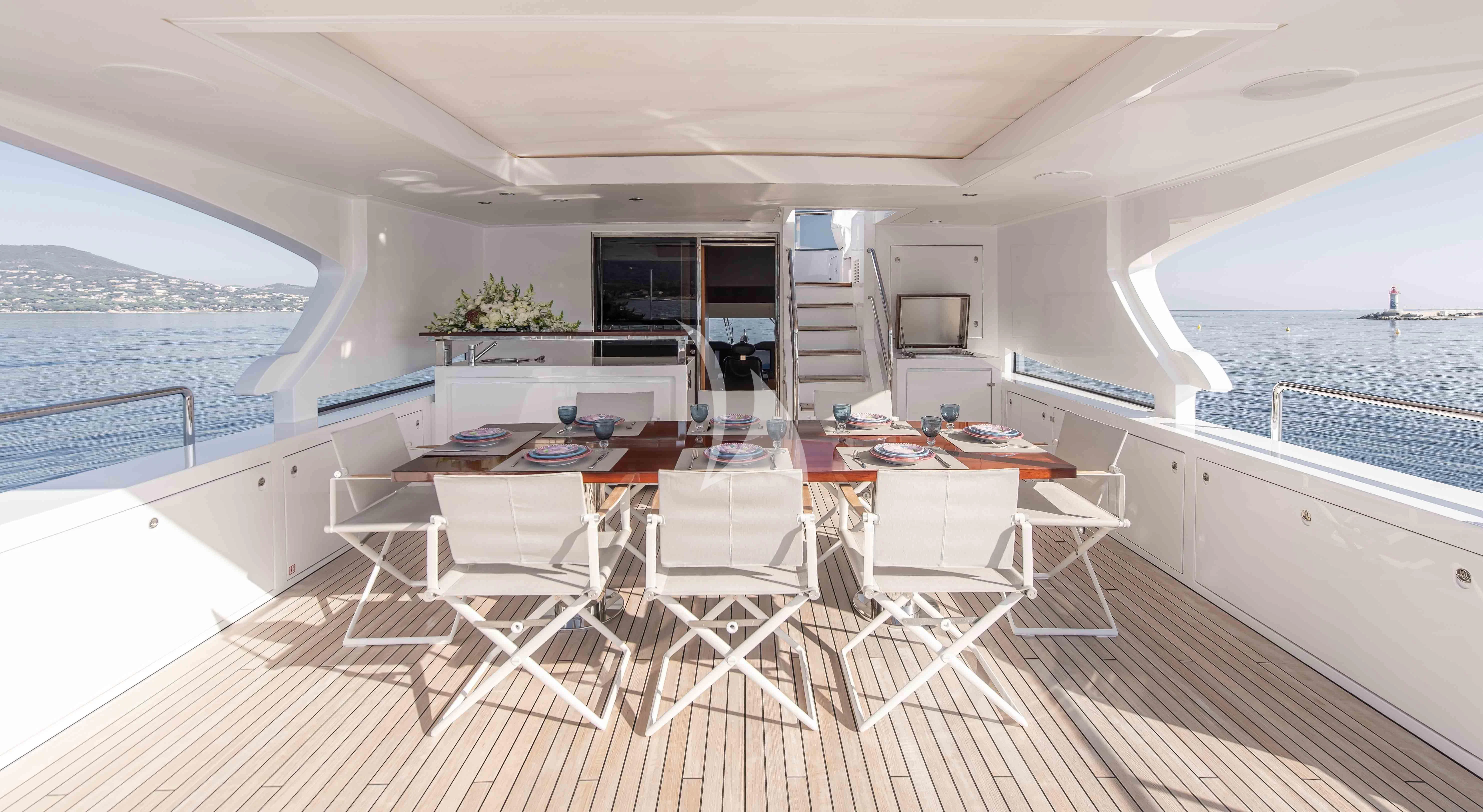 a large white dining table on a boat aboard TONIC BLUE Yacht for Sale