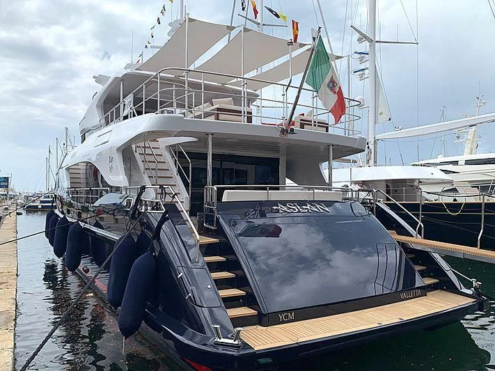 a boat docked at a pier aboard TONIC BLUE Yacht for Sale