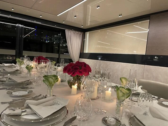 a table with plates and glasses aboard SOLEIL Yacht for Sale