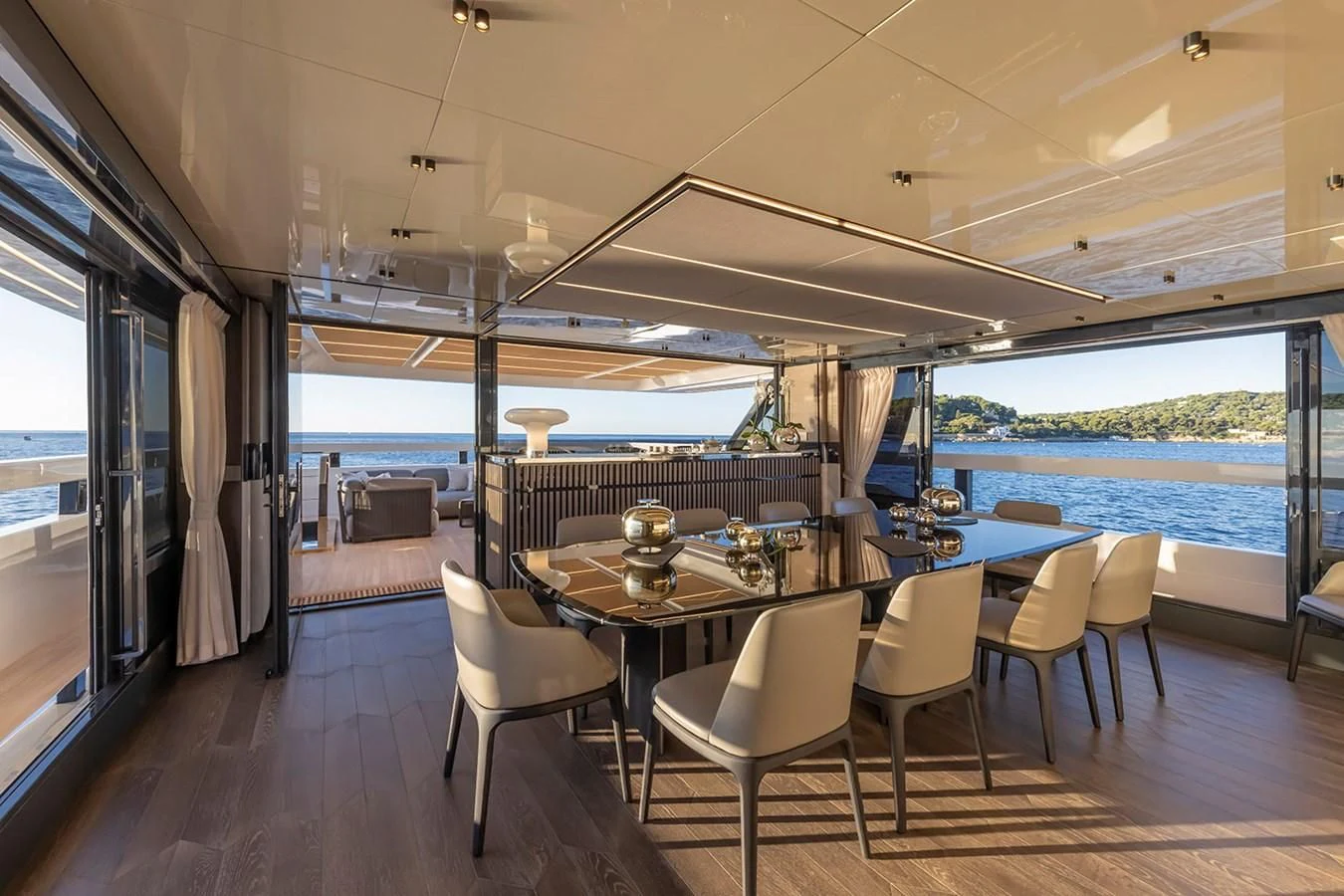 a room with a table and chairs aboard SOLEIL Yacht for Sale