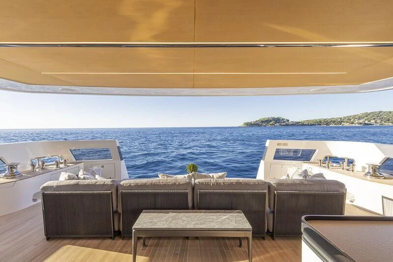 a room with a view of the ocean and a beach aboard SOLEIL Yacht for Sale