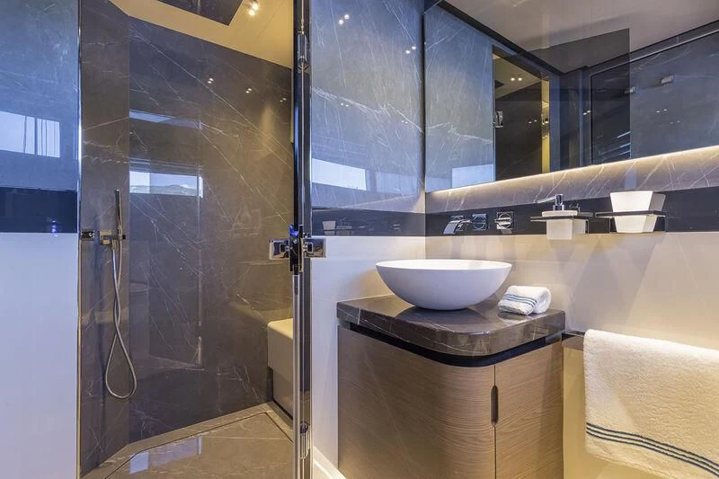 a bathroom with a sink and a shower aboard SOLEIL Yacht for Sale