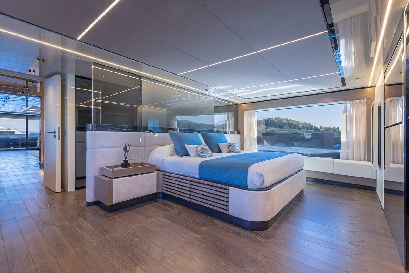 a room with a bed and a table aboard SOLEIL Yacht for Sale