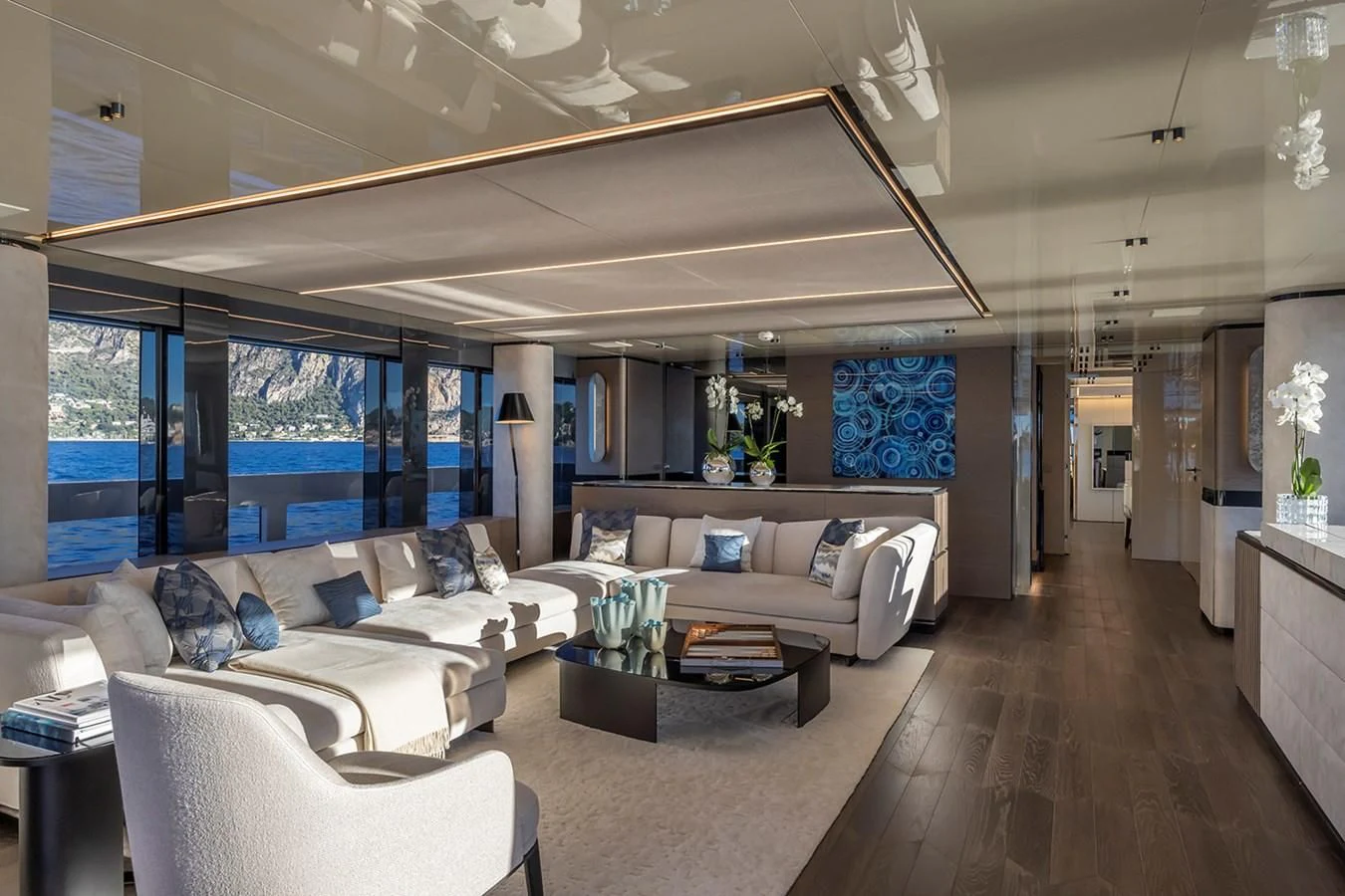 a living room with a large window aboard SOLEIL Yacht for Sale