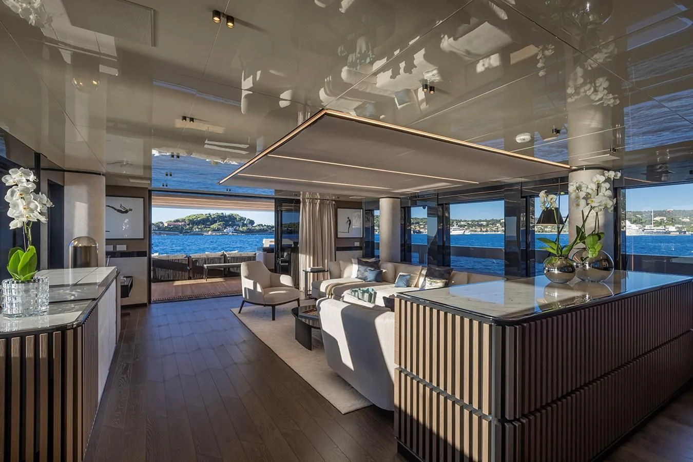 a modern looking living room with a large open roof aboard SOLEIL Yacht for Sale