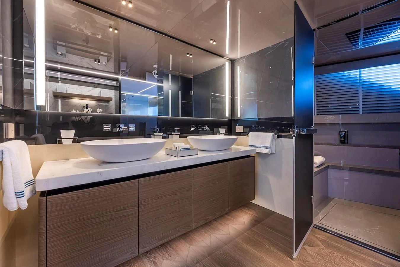 a bathroom with sinks and mirrors aboard SOLEIL Yacht for Sale