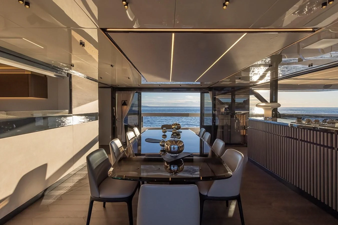 a room with a table and chairs aboard SOLEIL Yacht for Sale