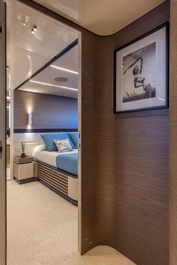 a room with a bed and a mirror aboard SOLEIL Yacht for Sale