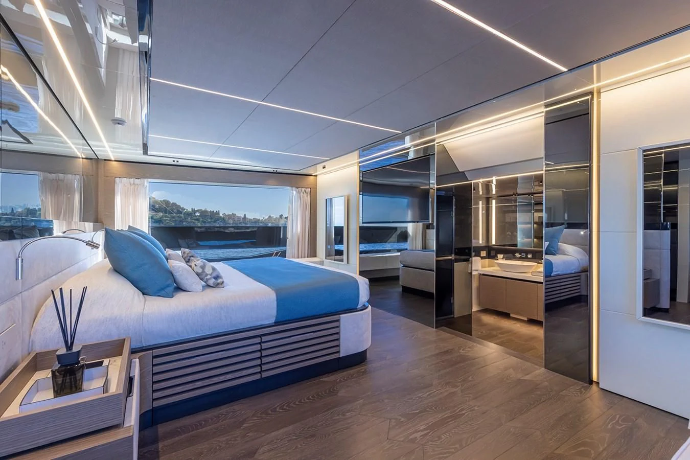a bedroom with a bed and a desk aboard SOLEIL Yacht for Sale