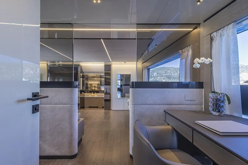 a kitchen with a table and chairs aboard SOLEIL Yacht for Sale