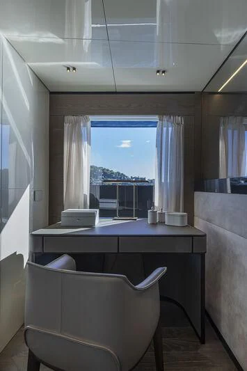 a room with a desk and a window aboard SOLEIL Yacht for Sale