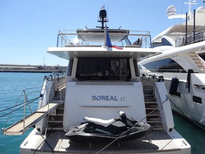 a boat docked at a pier aboard CASA Yacht for Sale