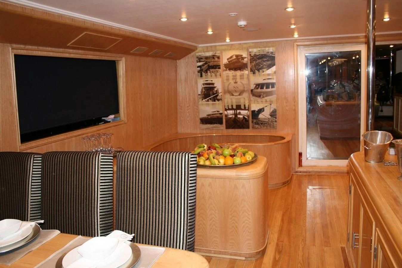 a room with a table and chairs aboard SCUBA SCENE Yacht for Sale