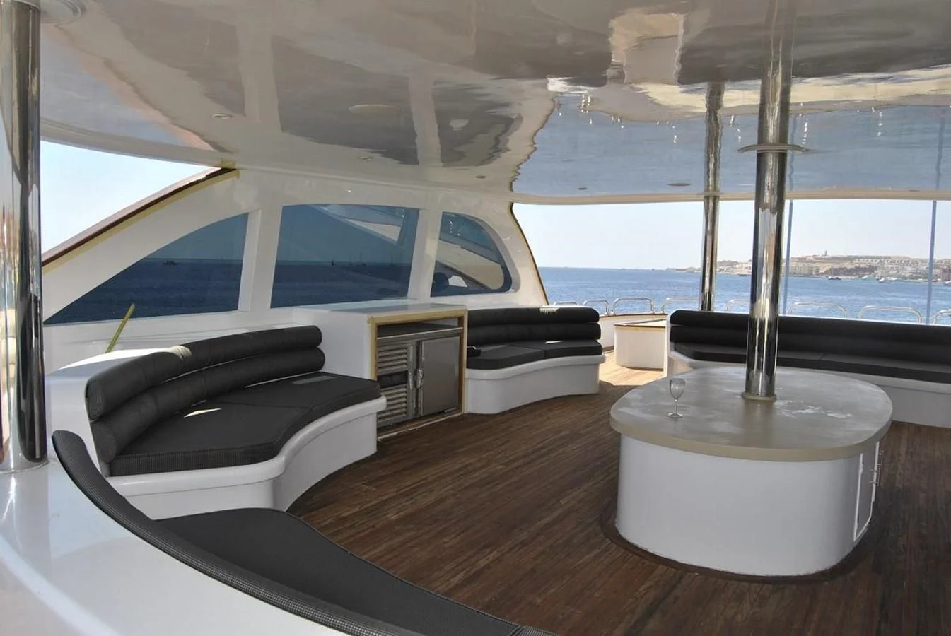 a room with a bed and a large window aboard SCUBA SCENE Yacht for Sale