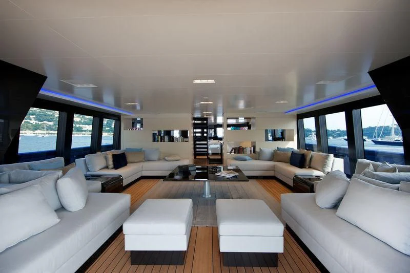 a living room with a large window aboard BETTER PLACE Yacht for Sale