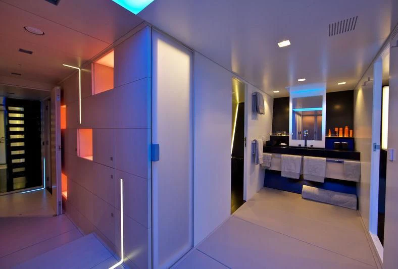 a room with a large blue wall aboard BETTER PLACE Yacht for Sale