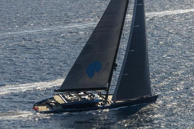 a black and silver boat on the water aboard BETTER PLACE Yacht for Sale