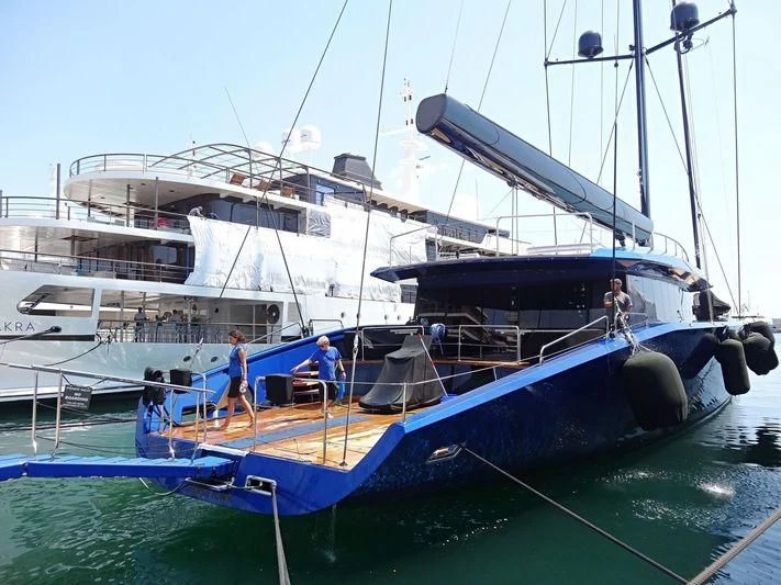 a boat docked at a pier aboard BETTER PLACE Yacht for Sale