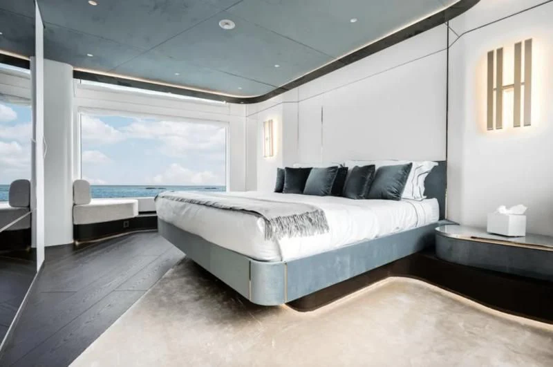 a large bed in a room aboard FIFTH SEASON Yacht for Sale