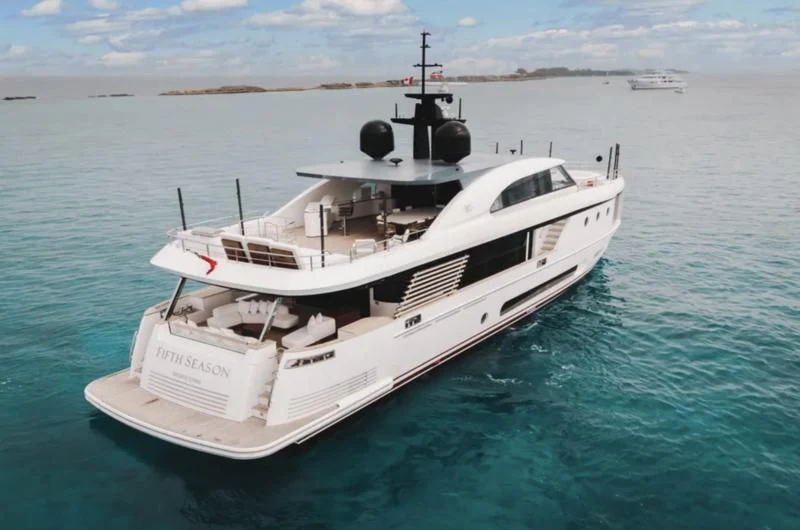 a white boat in the water aboard FIFTH SEASON Yacht for Sale