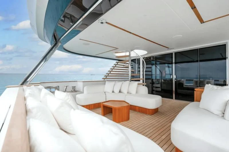 a room with a large bed and a large window aboard FIFTH SEASON Yacht for Sale
