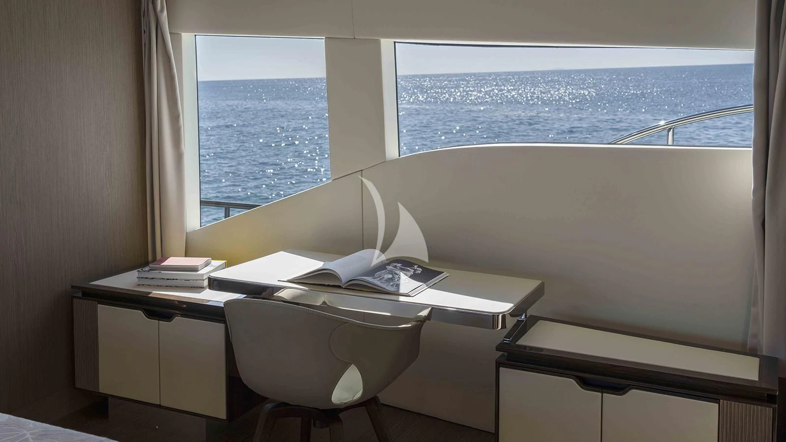a desk with a chair and a window aboard FOUR JOYS Yacht for Sale