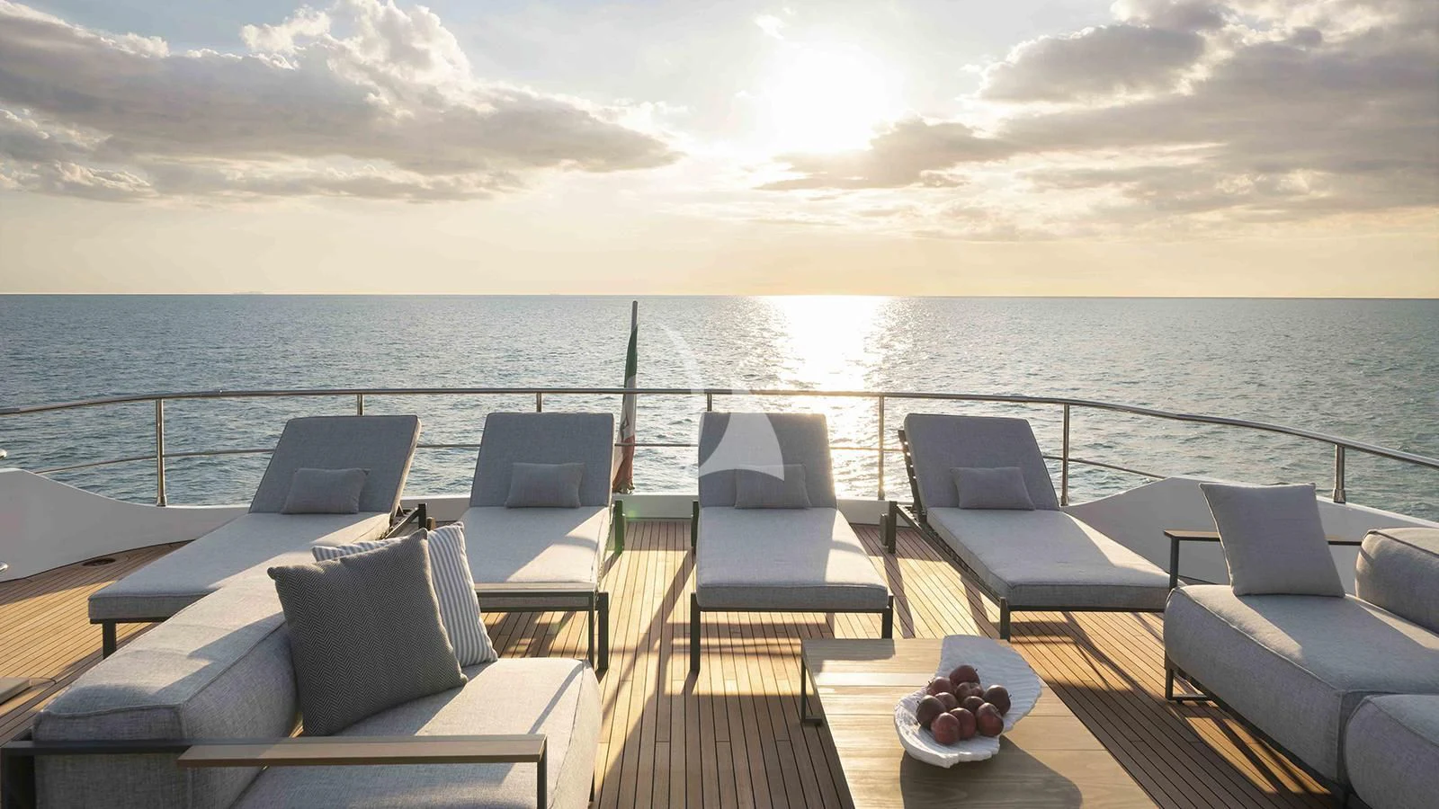 a deck with a view of the ocean and the ocean aboard FOUR JOYS Yacht for Sale