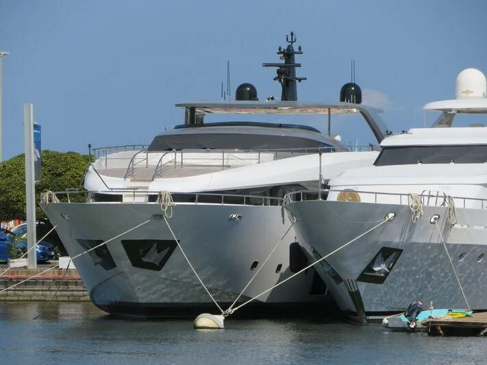 a white yacht docked aboard FOUR JOYS Yacht for Sale