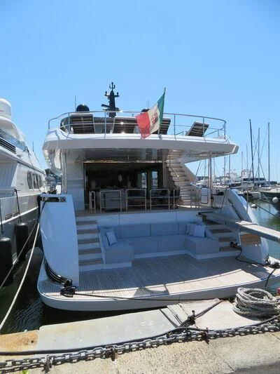 a boat docked at a pier aboard FOUR JOYS Yacht for Sale