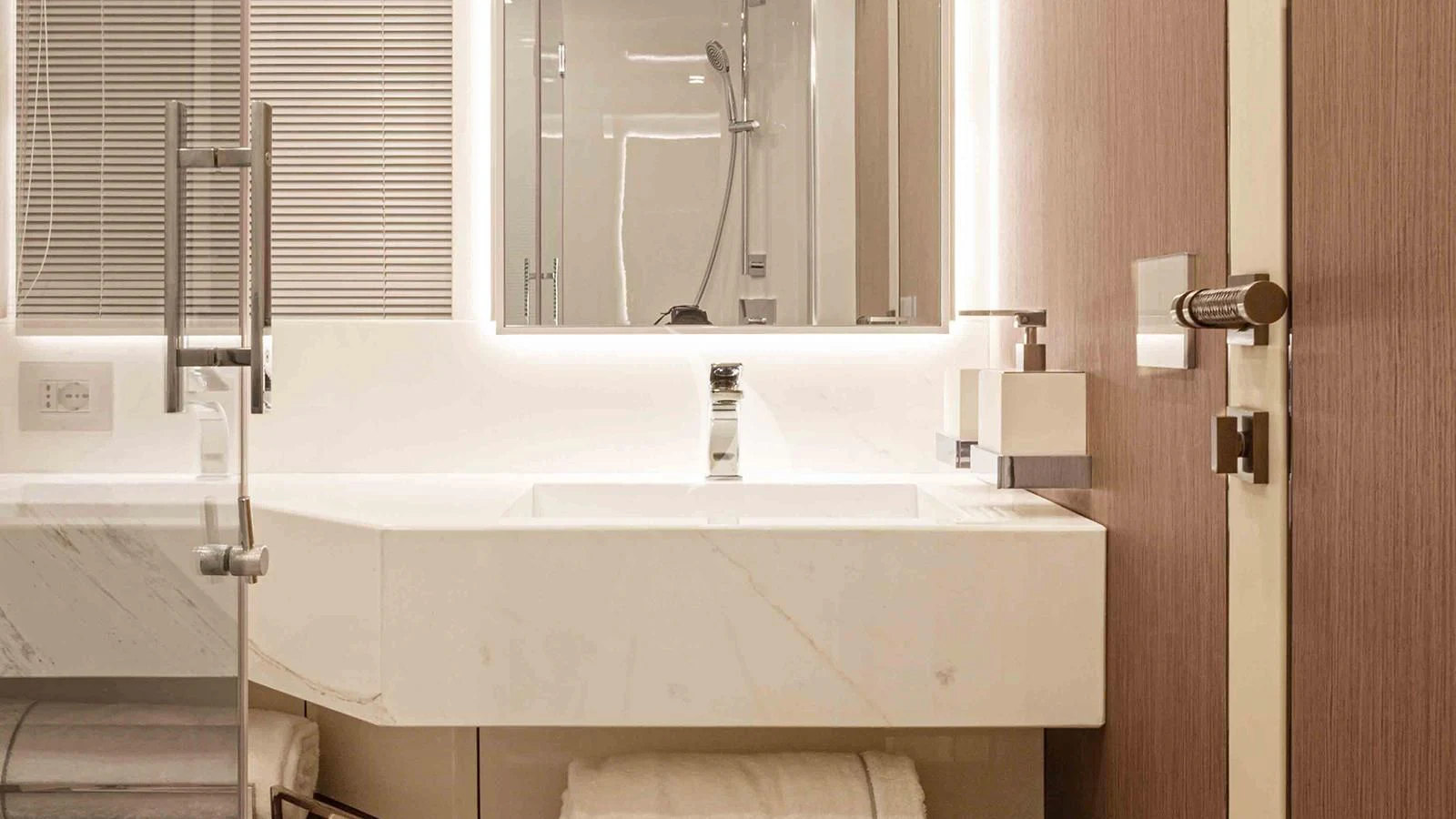 a bathroom with a sink and a mirror aboard FOUR JOYS Yacht for Sale