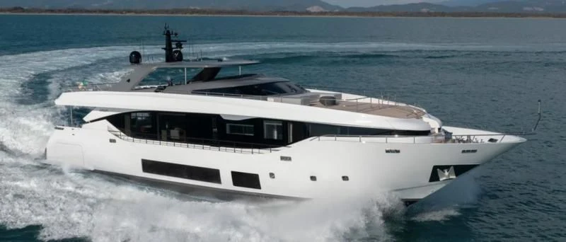 a white yacht on the water aboard FOUR JOYS Yacht for Sale