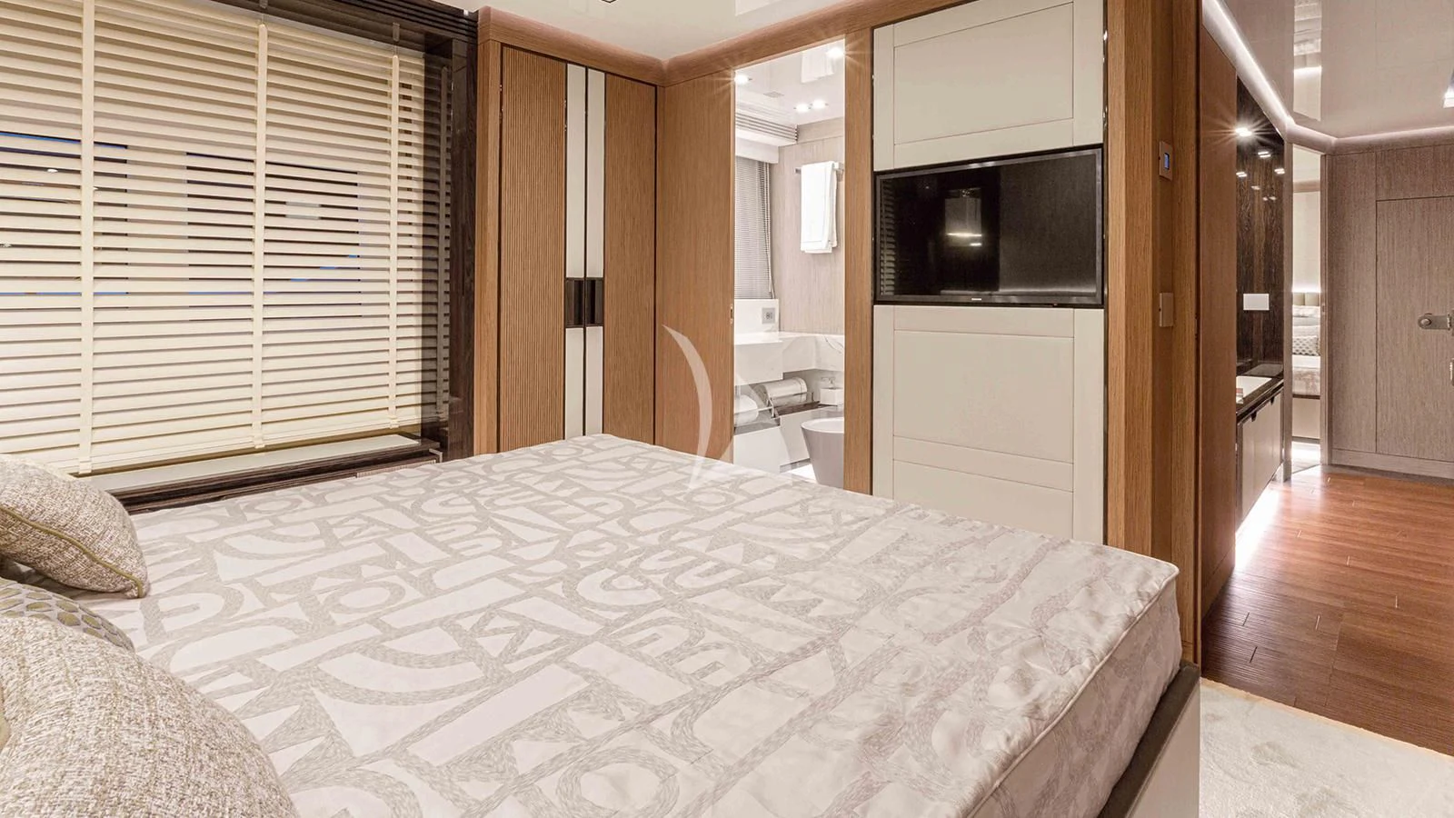 a bedroom with a bed and a television aboard FOUR JOYS Yacht for Sale
