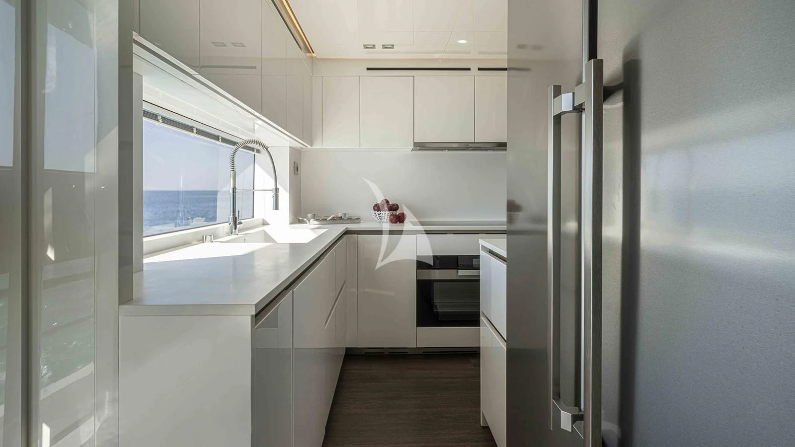 a kitchen with white cabinets aboard FOUR JOYS Yacht for Sale