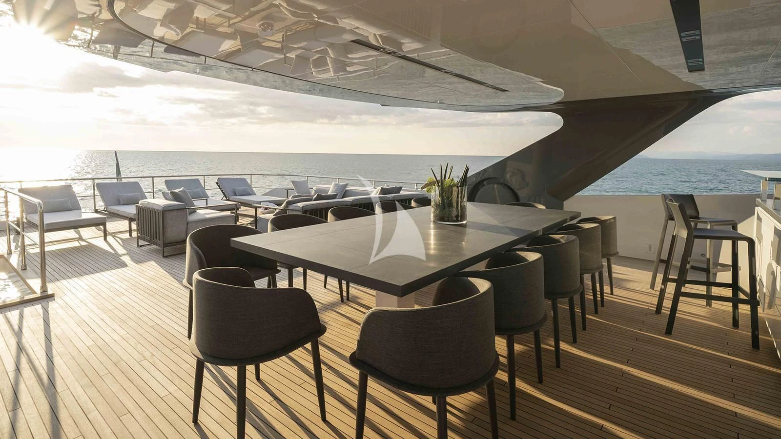 a room with a table and chairs aboard FOUR JOYS Yacht for Sale