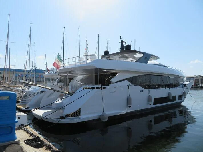 a boat docked at a pier aboard FOUR JOYS Yacht for Sale