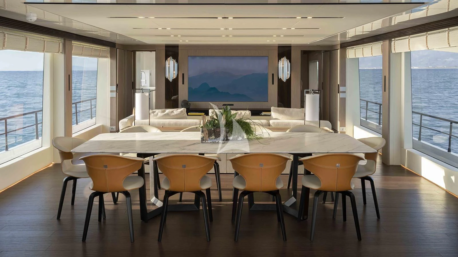 a large table with chairs around it aboard FOUR JOYS Yacht for Sale